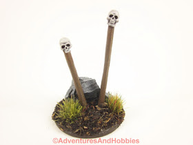 Front view of T1582 skull totems designed for 25 to 28mm scale miniature wargames.