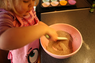 sieving flour for cupcakes