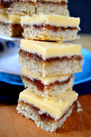 cookie bars topped with rhubarb jam and a custard flavoured icing