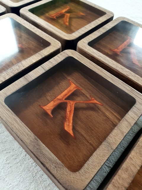 Embedded letter in epoxy resin and walnut wood