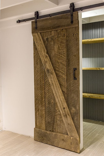 rustic, laundry room with sliding barn door