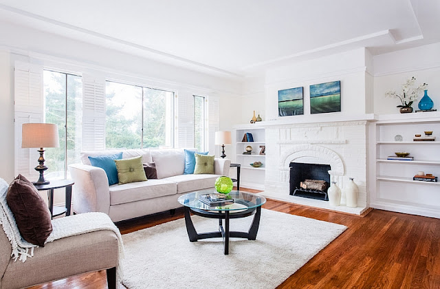 white feng shui living room with fireplace