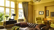 Brown Sofa Yellow Wall Decoration