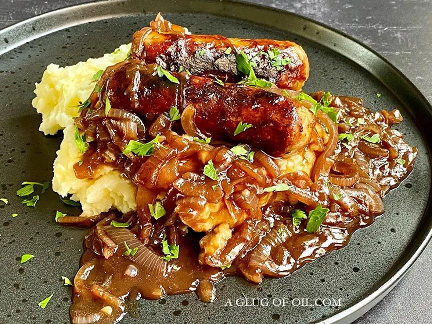 Bangers and mash with onion gravy (sausage and mash).