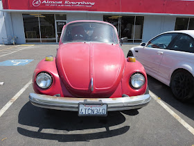 1974 Volkswagen Beetle with faded paint before repairs at Almost-Everything Auto Body