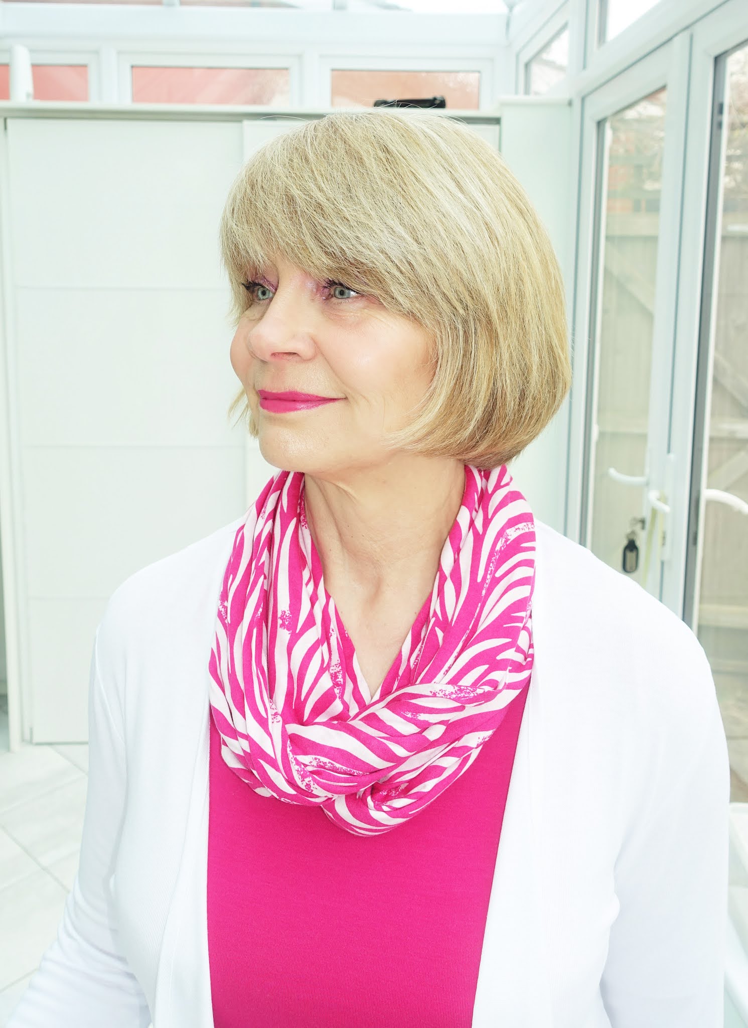 Over 50s blogger Gail Hanlon in bright pink and white