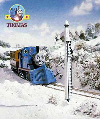 Thomas the train has stopping opposite a meadow for a red railway signal seeing Terence and the Snow