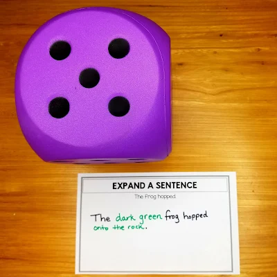 Dice with text: Expand a sentence