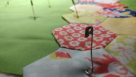 EPP hexies in Coney Island fabrics by Fig Tree & Co. for Moda