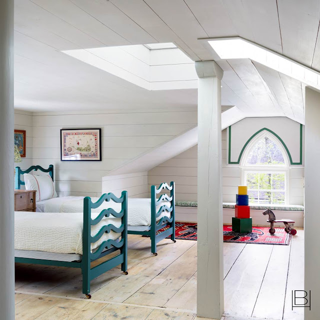 Beata Heuman attic kids room with all white wood paneled walls and antique turquoise twin bed frames