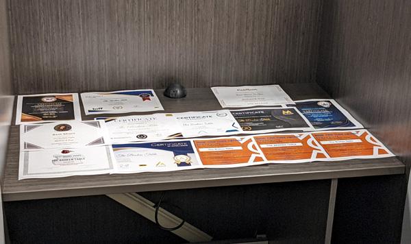 Print-outs of THE BROKEN TABLE's 13 award certificates.