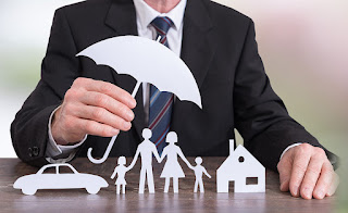 Man showing symbols of different insurance sectors: Life insurance, health insurance, and general insurance.