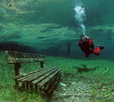 Diver exploring a pristine Alpine Park that turns into an inland lake for 