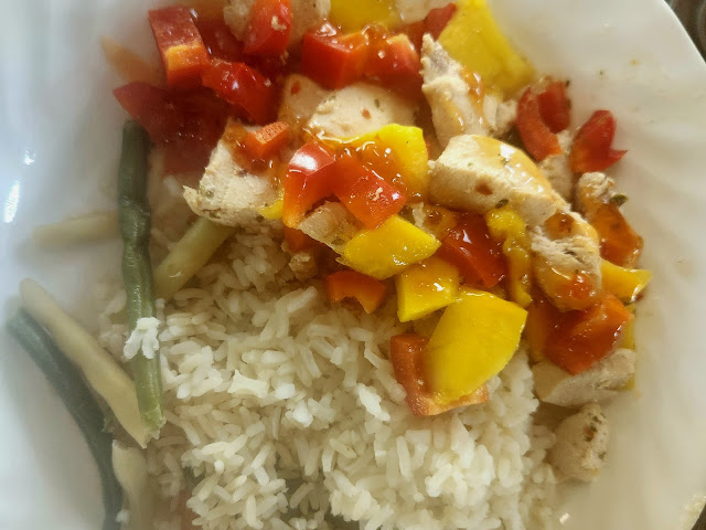 Mango chicken on plate.