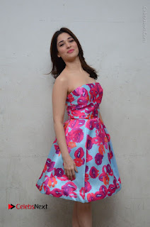 Actress Tamanna Latest Images in Floral Short Dress at Okkadochadu Movie Promotions  0080.JPG