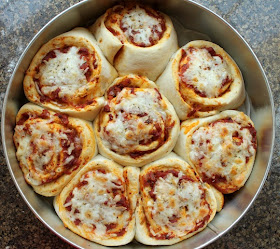 Food Lust People Love: Imagine a soft dough, shaped like cinnamon rolls, but savory, baked up with pizza sauce and mozzarella. Madam Wong's Pizza rolls are delicious and portable. Perfect in a lunchbox!