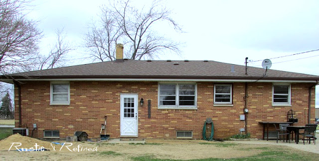 Brick ranch home before any landscaping installed - a garden plan