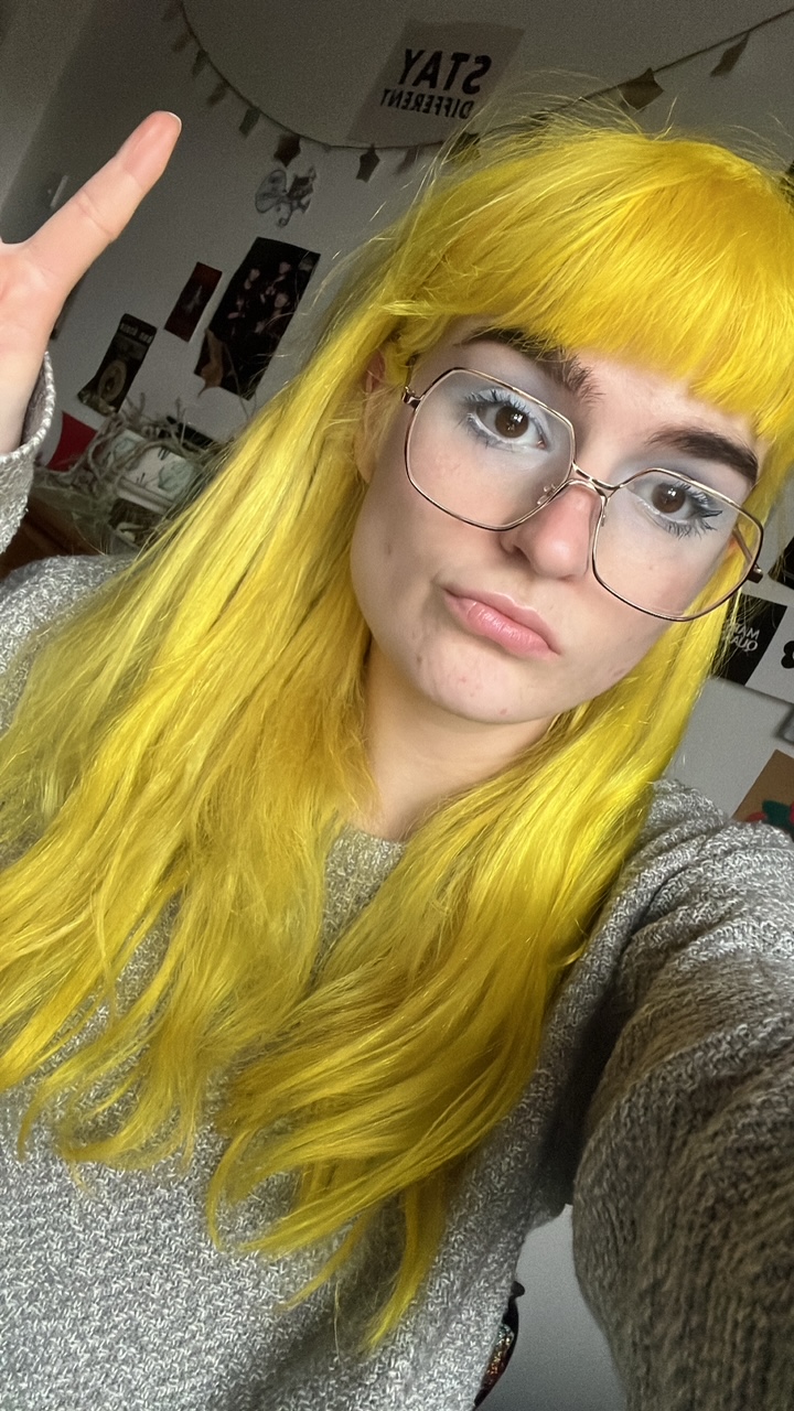 Bleach London Twisted Lemon freshly dyed on long wavy hair in natural light