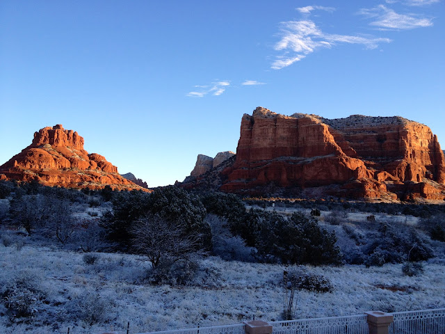 Early morning view of Bell Rock and Courthouse Butte in snow