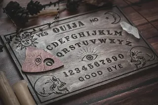traditional board carved with symbols to communicate with dead