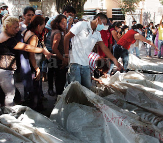 Honduran prison fire: searching through body bags