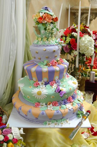 Simple and colorful Alice in Wonderland 4 tier wedding cake in soft muted