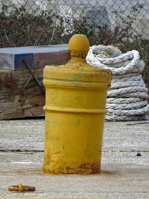 Old cannon used as bollard, small dry dock, port of Livorno