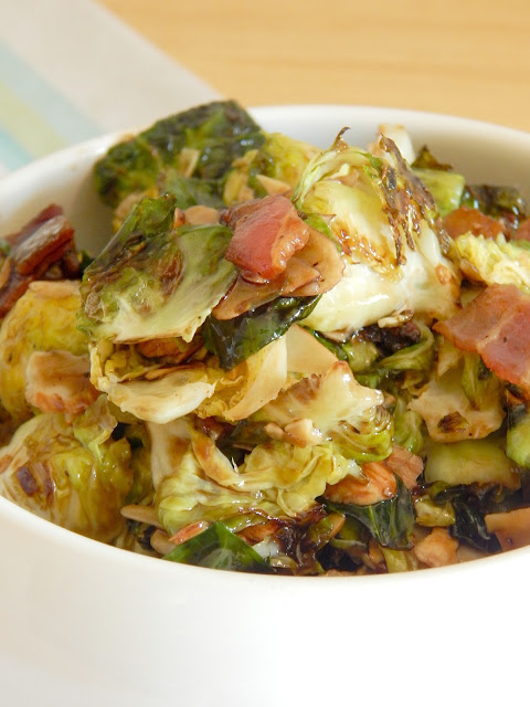 Crispy Brussels Sprouts with Bacon...this jazzed up veggie side dish is fun and new!  Roasting the brussels sprouts with bacon and tossing them in a sweet glaze makes them perfect for any dinner. (sweetandsavoryfood.com)