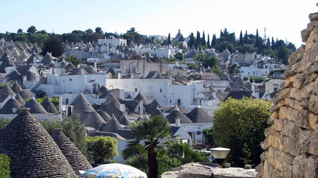 Alberobello, the city of drystone dwellings known as trulli , is an exceptional example of vernacular architecture. It is one of the best preserved and most homogeneous urban areas of this type in Europe. Its special features, and the fact that the buildings are still occupied, make it unique. It also represents a remarkable survival of prehistoric building techniques.