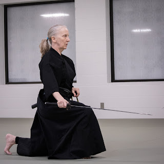 a person practicing iaido, a martial art in Ann Arbor