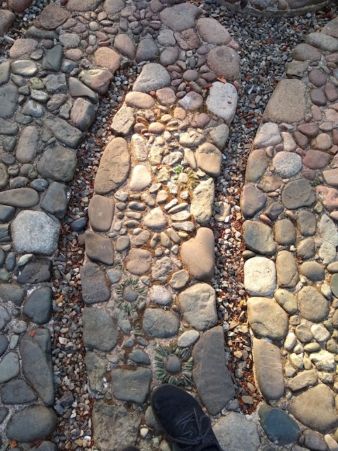Mosaic flowers on the labyrinth path