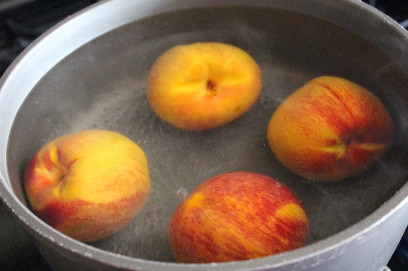 Remove the peaches and immediately submerge them into a bowl with ice ...