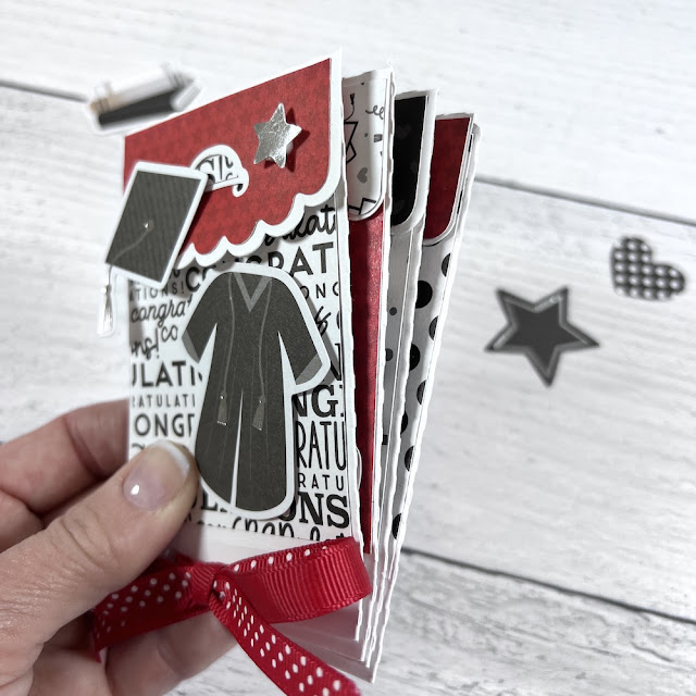 Graduation gift card holder with pockets, a star, and a cap and gown