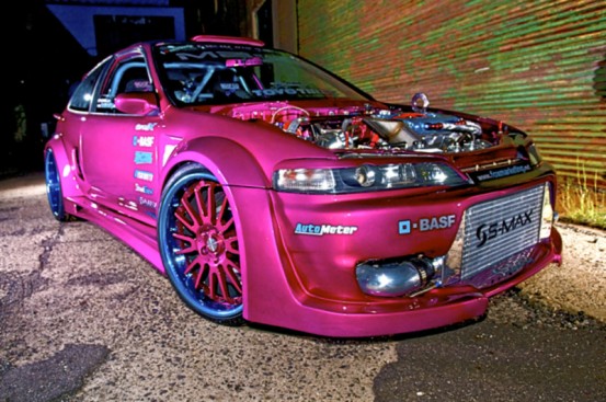 Pink honda hatchback with low suspension and full modified