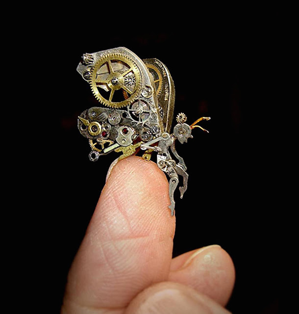 Intricate steampunk sculpture of recycled old parts watch