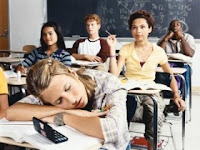 Teenagers sleeping in class.