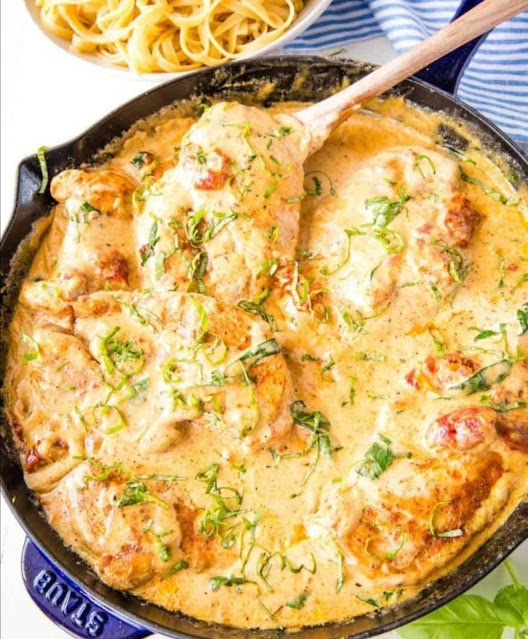 Tuscan chicken is a delectable Italian-inspired dish that captures the rustic and flavorful essence of the Tuscan countryside. This dish typically features tender chicken breasts or thighs cooked in a rich and creamy sauce, often prepared with ingredients like sun-dried tomatoes, garlic, spinach, and aromatic herbs such as rosemary and thyme. The sauce is frequently made with a combination of heavy cream, chicken broth, and Parmesan cheese, resulting in a velvety and savory flavor profile.  Tuscan chicken is known for its harmonious blend of textures and tastes, making it a popular choice for those who crave a comforting and satisfying meal with a touch of Mediterranean flair. Whether served with pasta, rice, or crusty bread, this dish is a delightful way to bring the warmth and flavors of Tuscany to your table.