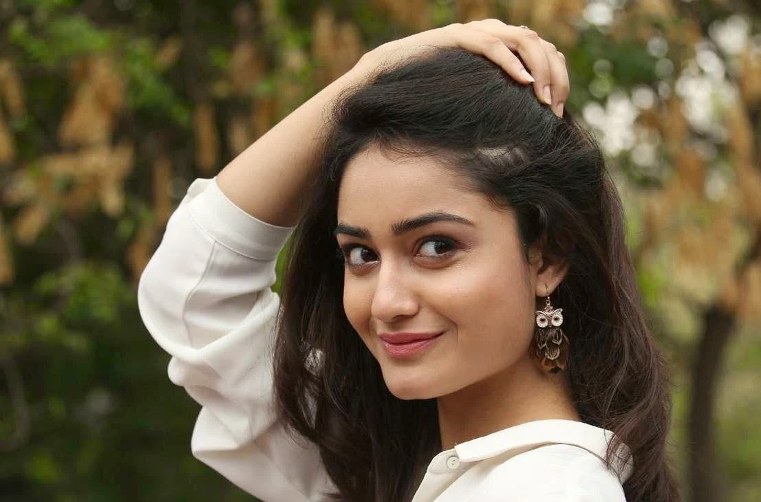 Glamorous Bengali Girl Tridha Choudhury Long Hair Photos In White Dress