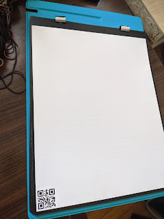 Rocketbook Flip Chart that is legal sized on a teal board