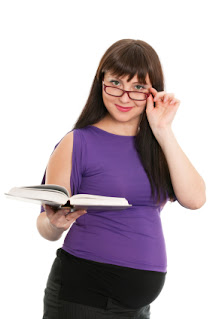 Pregnant women with glasses and a book