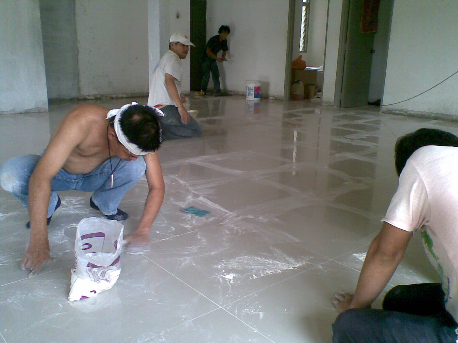 bathroom shower screens Grouting with cement colour in between joints.