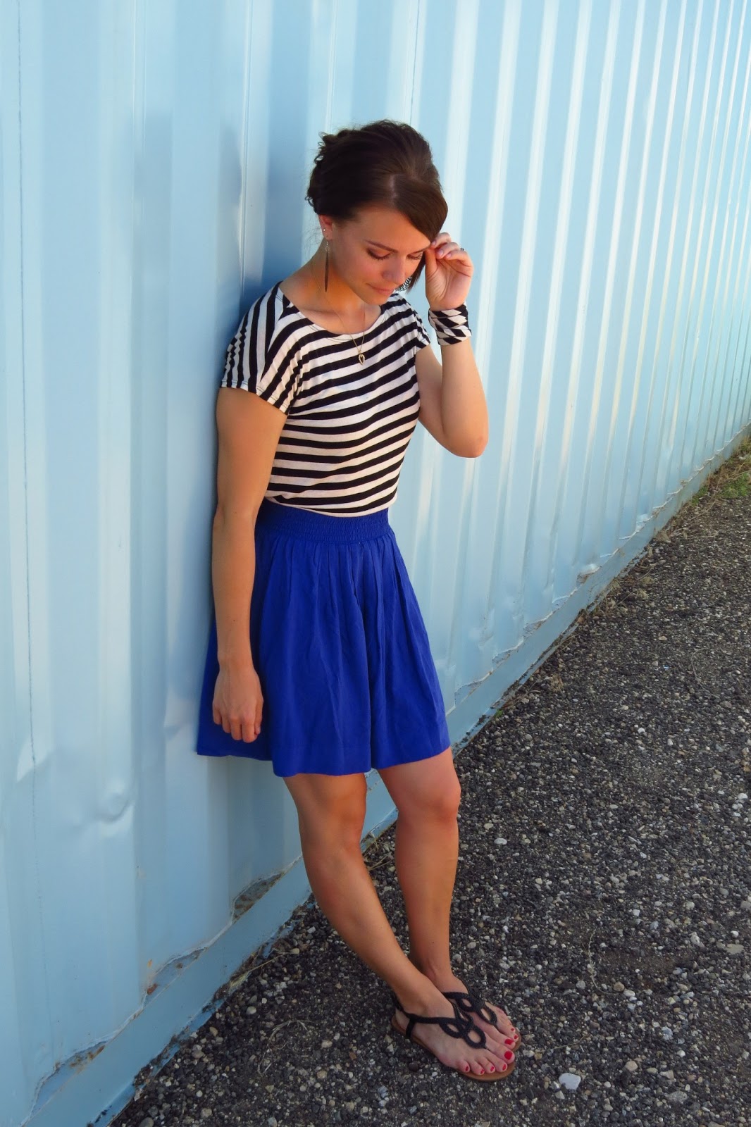 striped top and high-waisted skirt