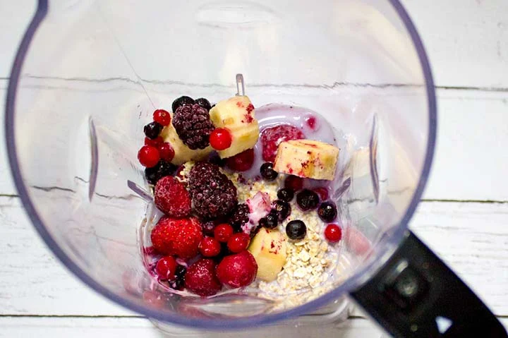 Healthy breakfast smoothie in a blender jug.