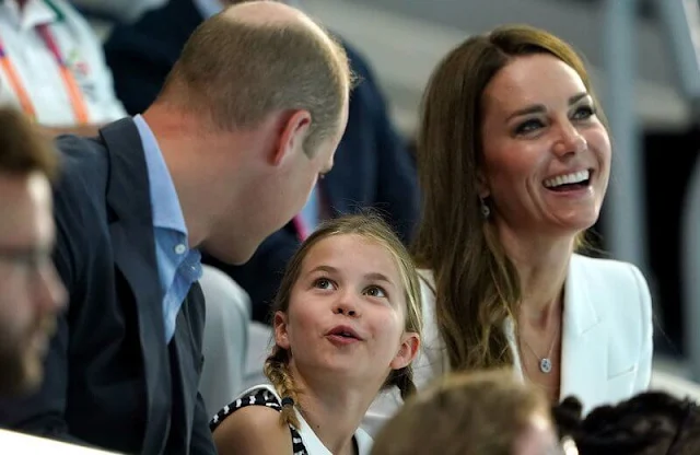 Princess Charlotte wore a new navy breton stripe jersey dress by Rachel Riley. Alexander McQueen suit. Penelope Chilvers Wedges