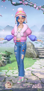 Alina dressed for winter in a pink overcoat and blue hair