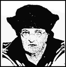 A newspaper image of a middle-aged white woman with stern features and wire-rimmed glasses, wearing a dark sailor-style hat and blouse with sailor-style collar