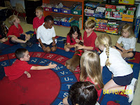 Children Sitting on a rug playing