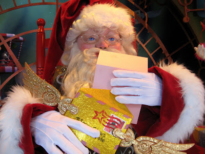 Santa Claus Reading Letters in Macy's Window