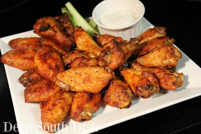 Chicken wings with a zing! Meaty chicken wings, coated with a lightly spicy rub and marinated in the fridge for an hour or up to overnight, baked and tossed with a simple, classic buttery hot sauce or a wing glaze.