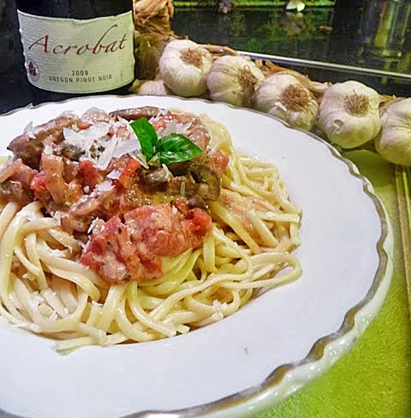 Sweet Italian Chicken Sausage with Tomato Cream Sauce Over Linguine